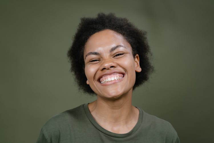 A Woman Flashing A Toothy Smile