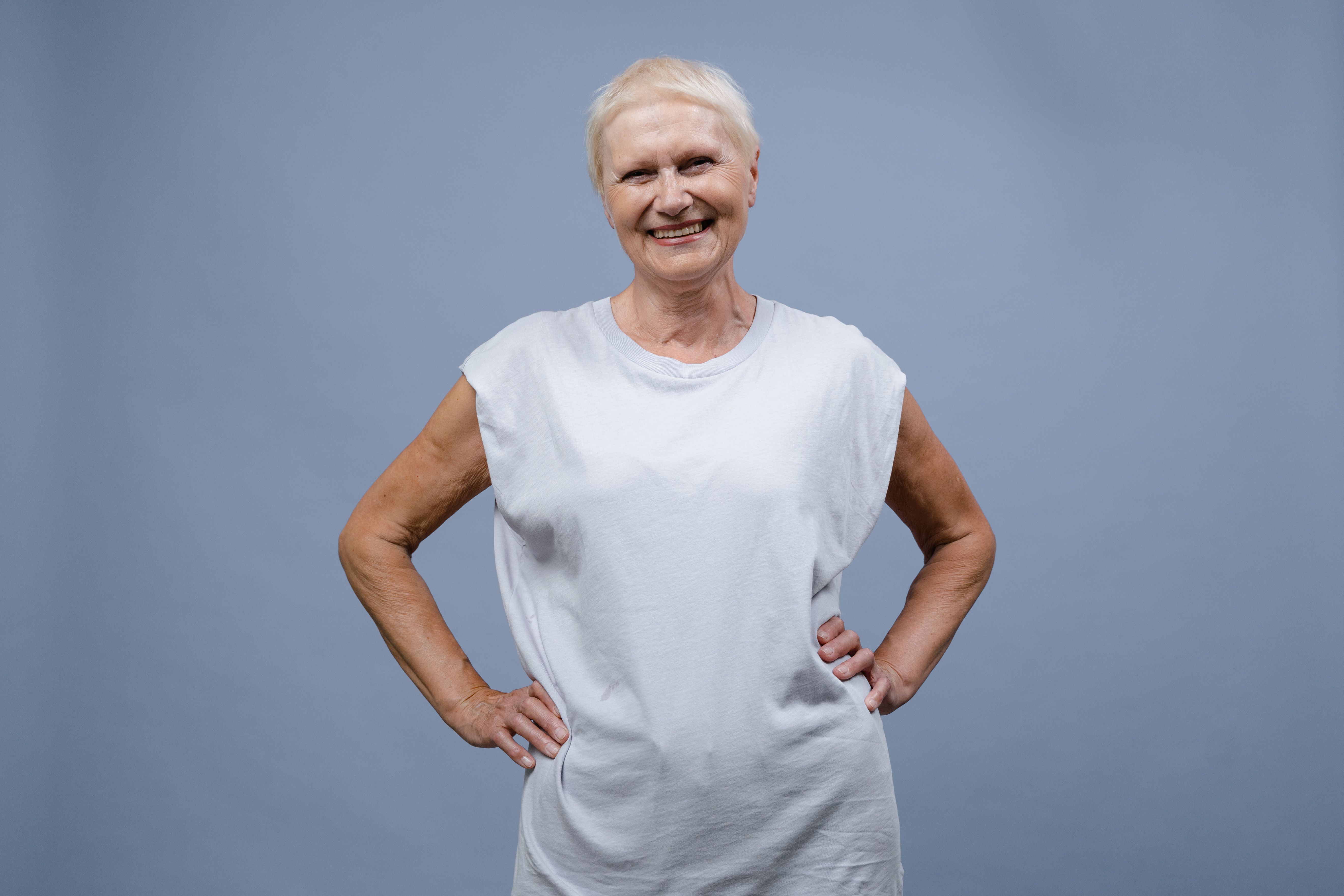 Smiling confident woman with natural grey hair