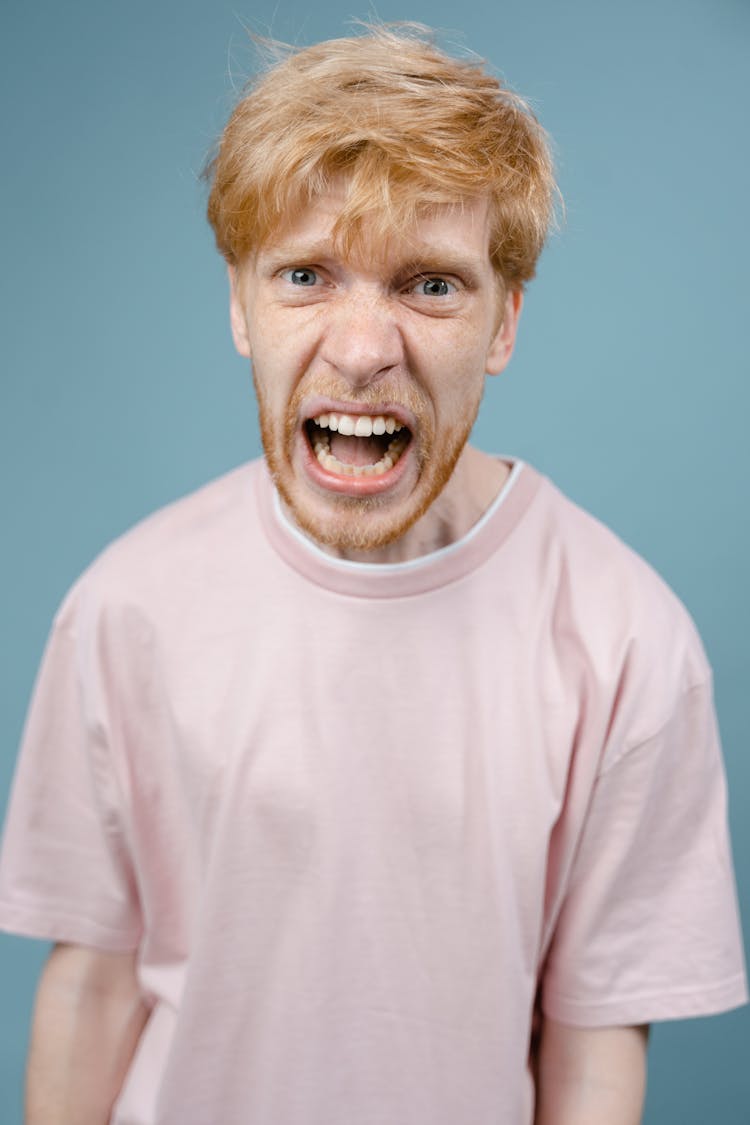 Man In Pink Shirt Shouting