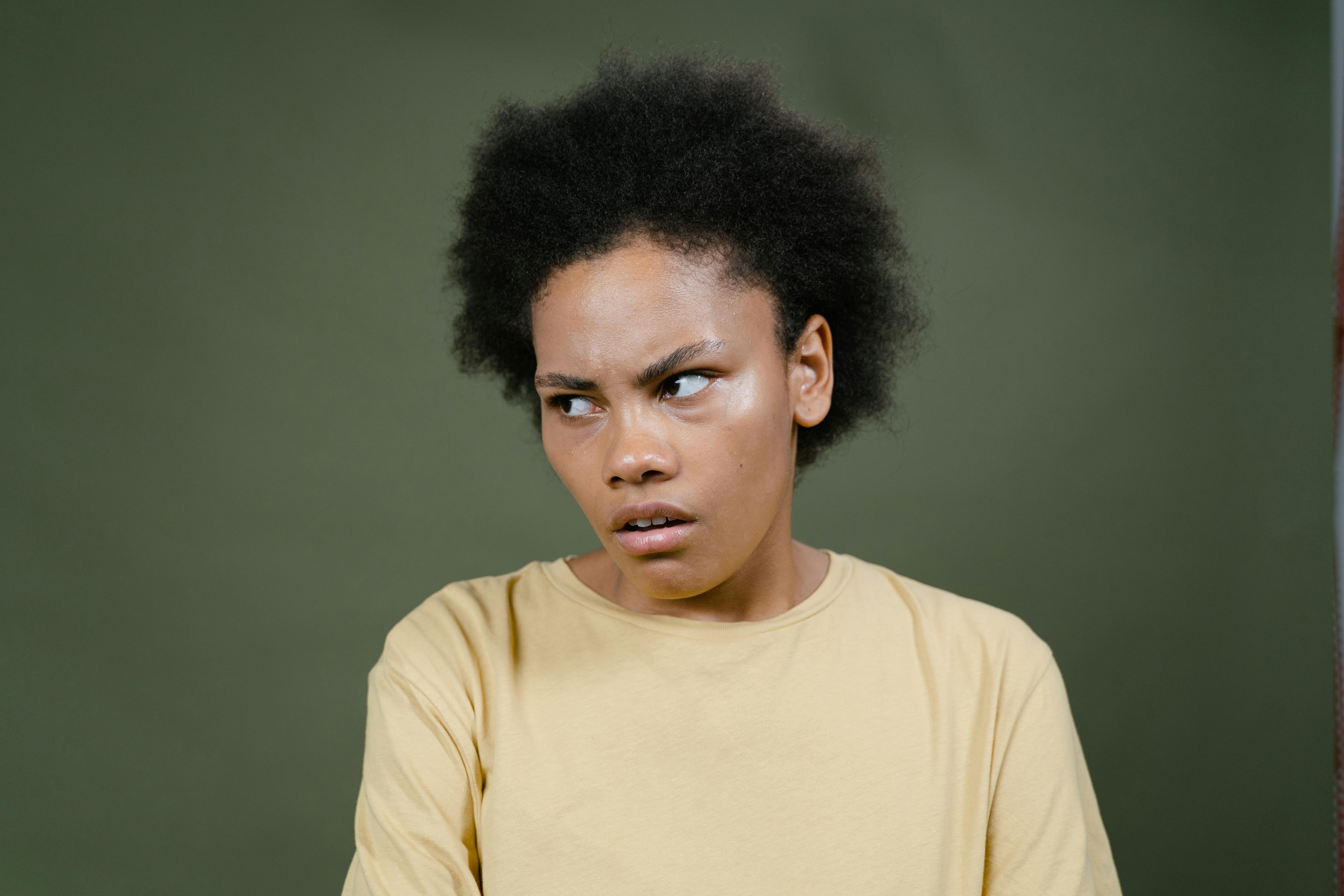 close up photo of a young woman looking pensive