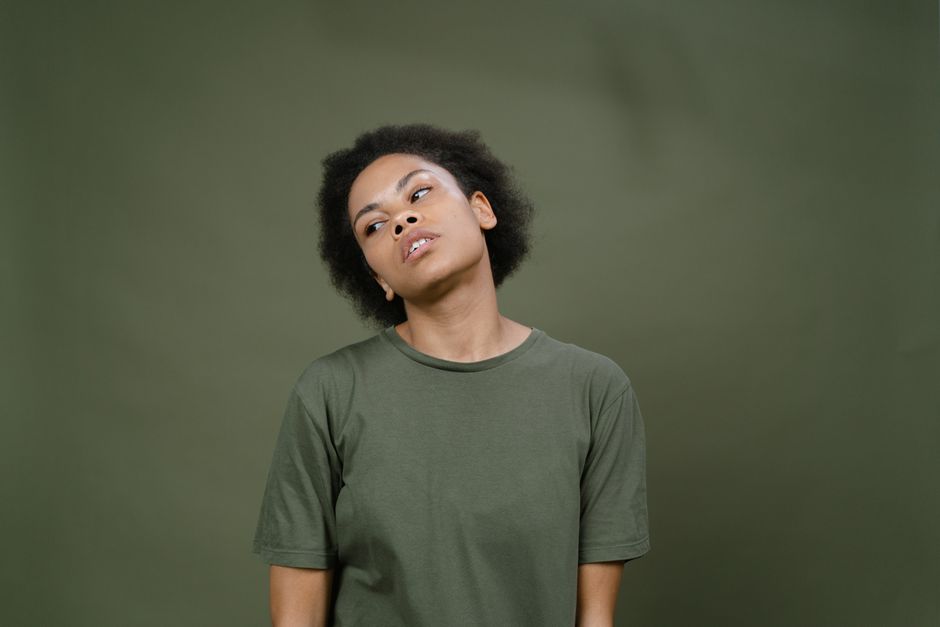 A Woman in Gray Shirt with Her Head Up