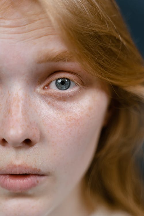 A Close-up Shot of a Woman with Half Face