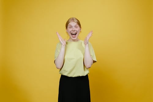 Free Woman in Yellow Shirt Smiling Stock Photo