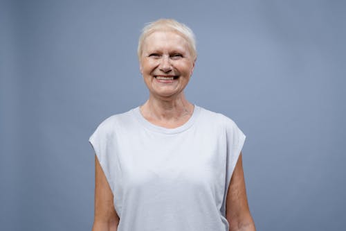 Elderly Woman in White T-shirt Smiling
