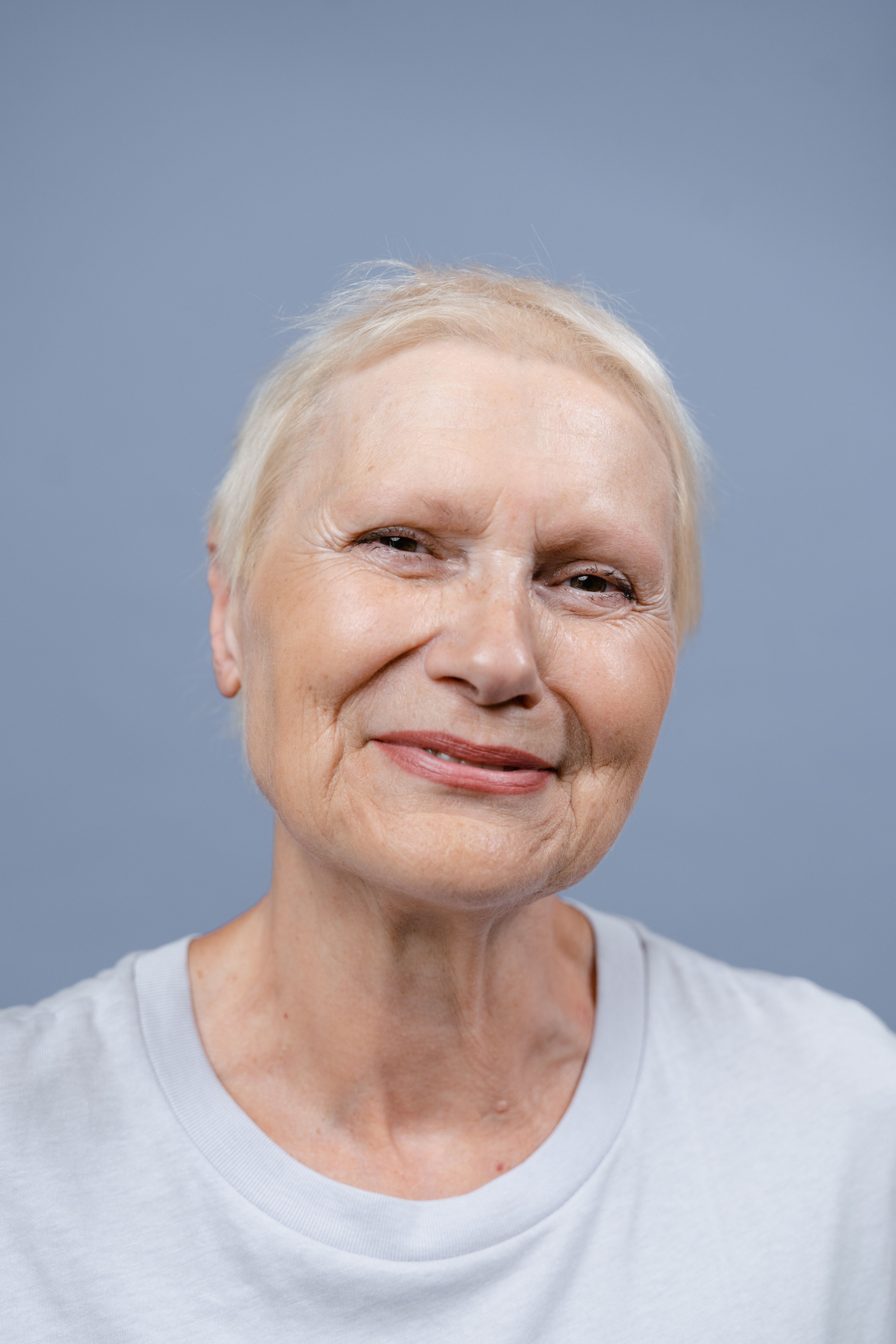 Senior woman smiling directly at the camera