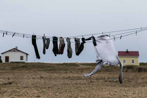 Socks and Jumper Hanging on a Wire for Drying
