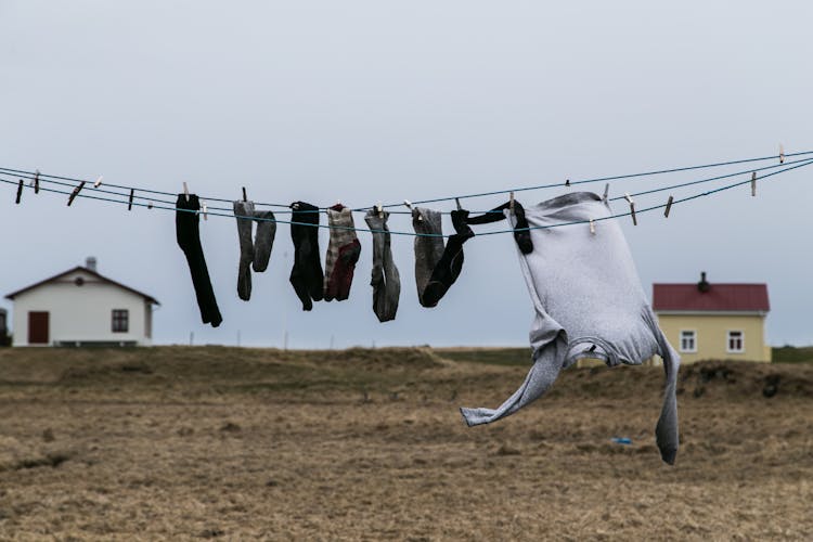 Socks And Jumper Hanging On A Wire For Drying