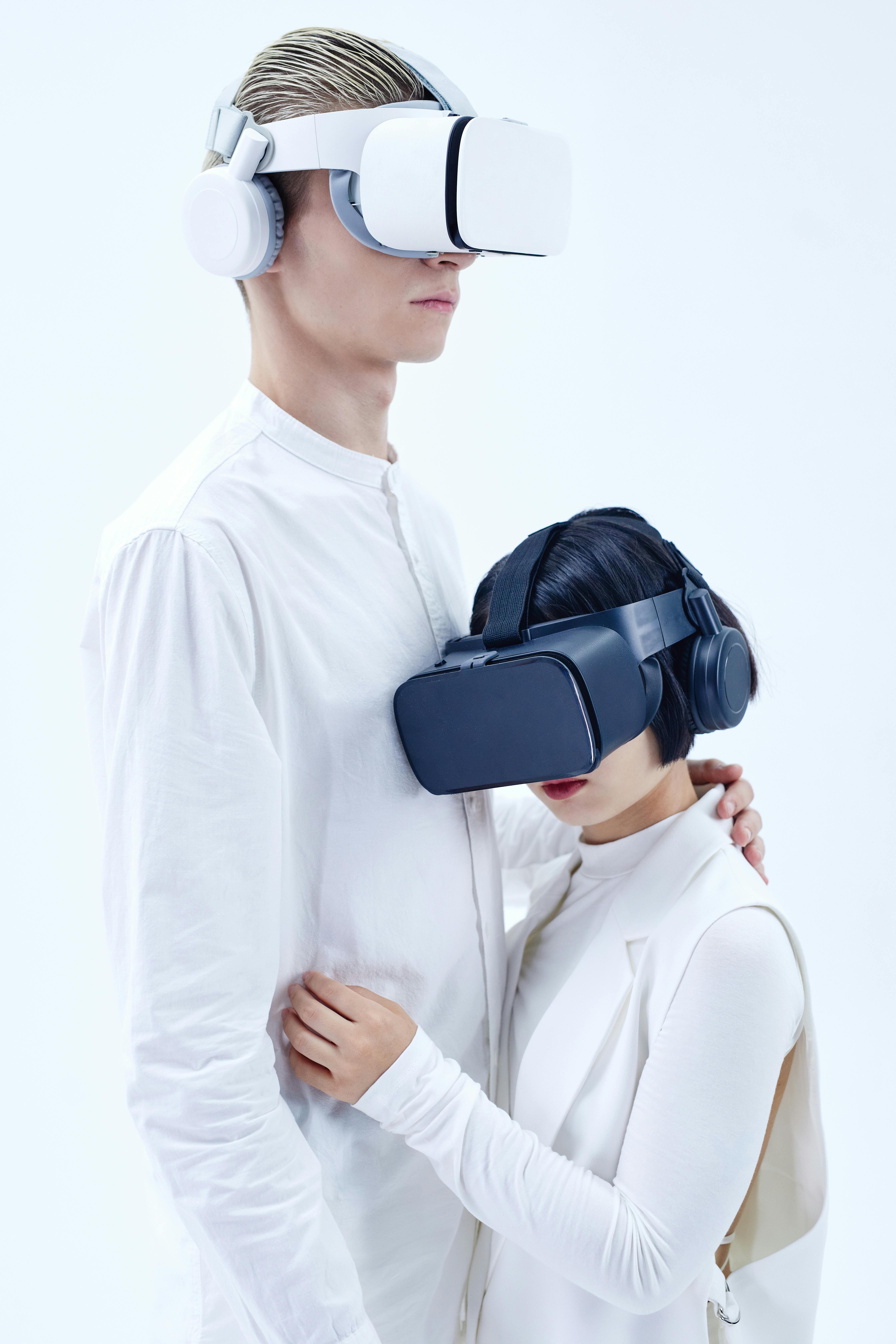 man and woman in white clothes wearing oculus quest