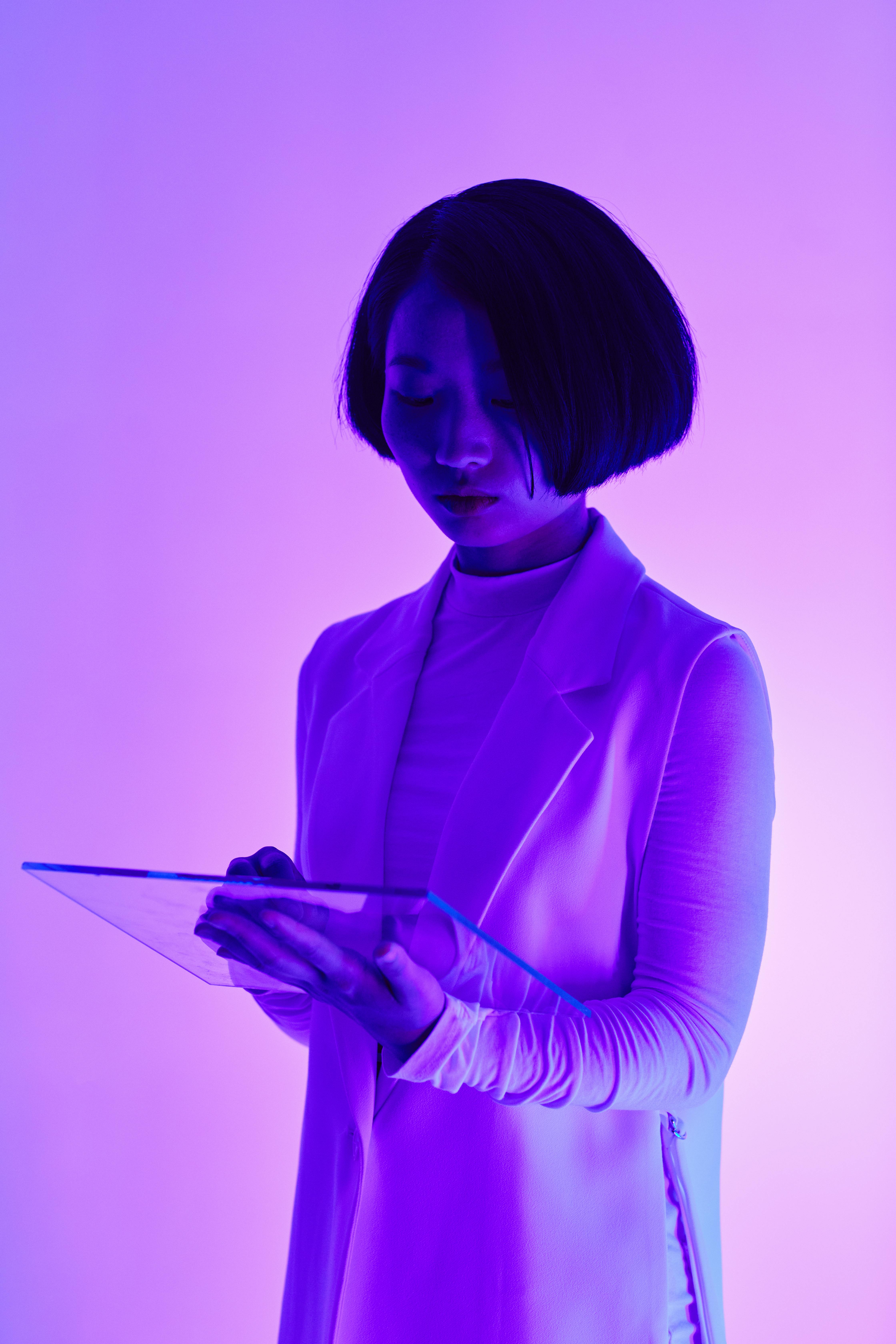 a woman holding a digital tablet