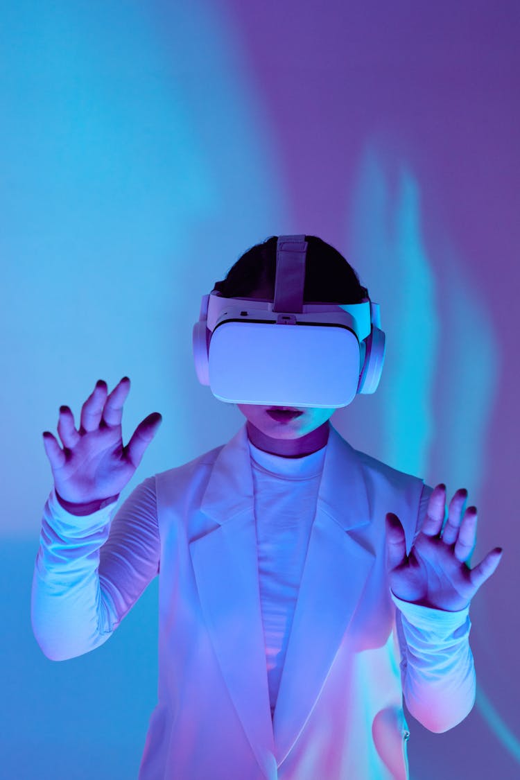 Woman In White Clothes Wearing VR Goggles