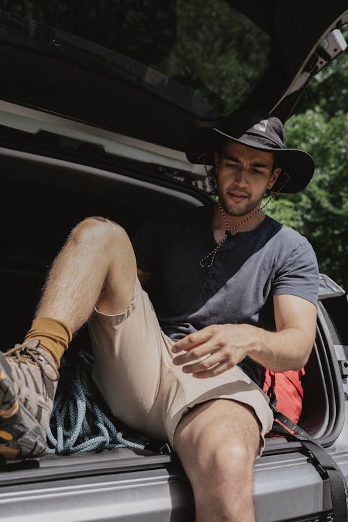 Man Sitting on the Trunk