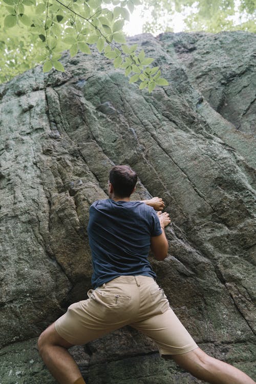 Man Climbing on a Rock Mountain