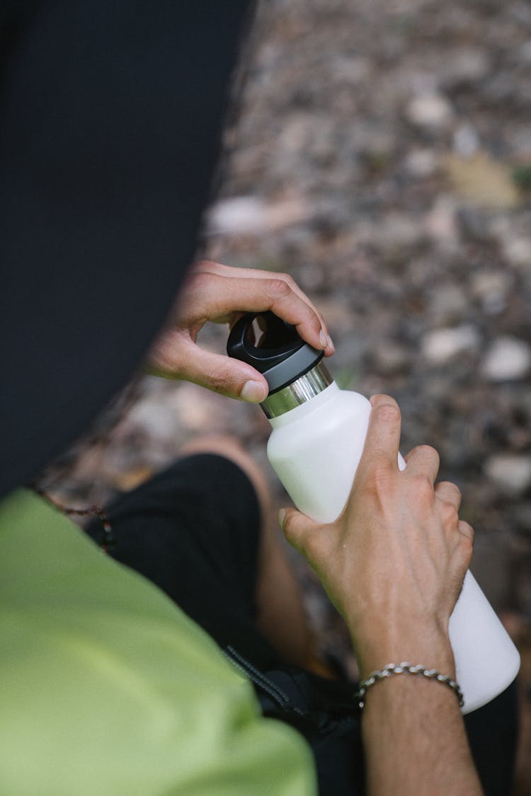 Man Opening His Water Bottle