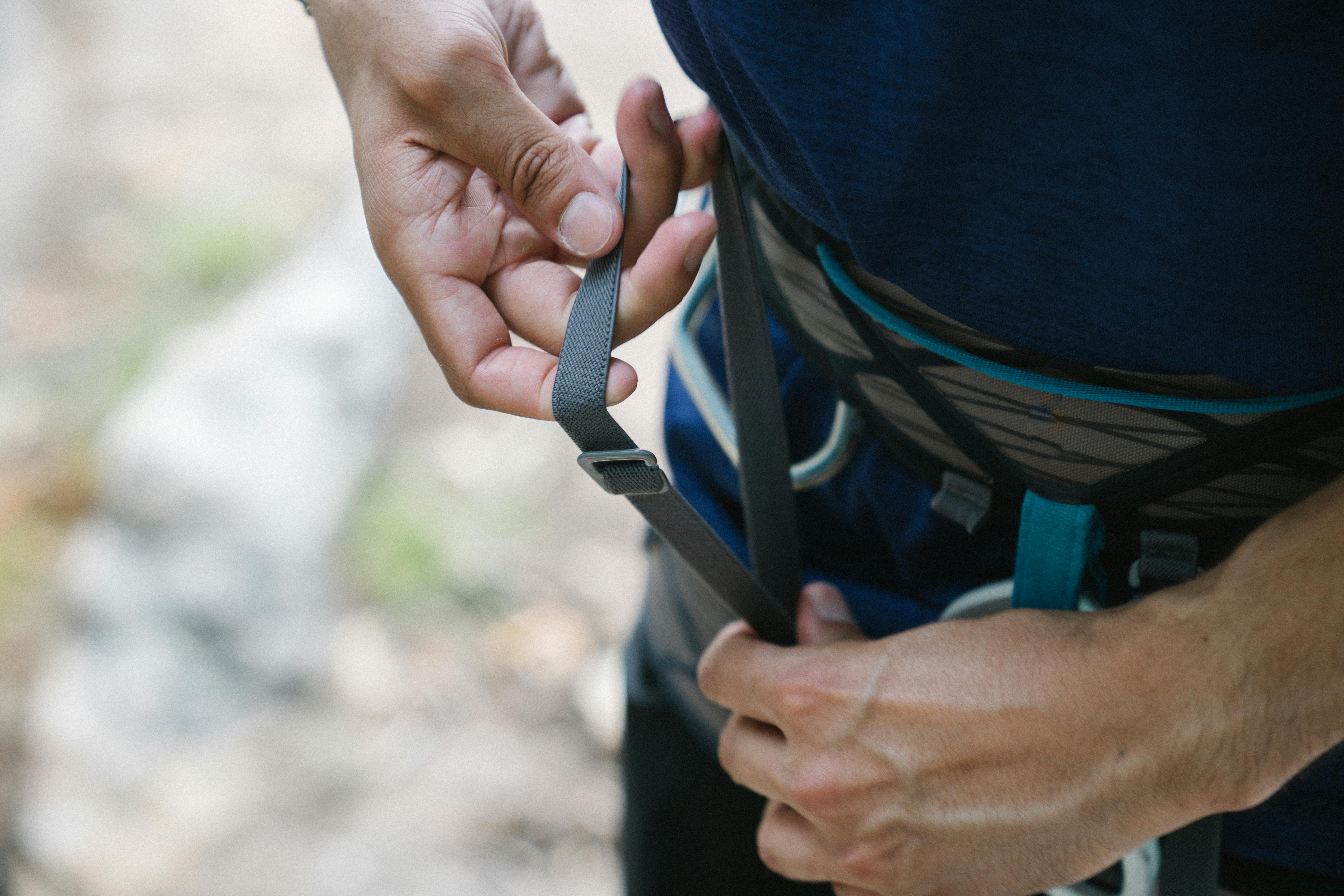 CloseUp Shot of a Person Putting a Harness · Free Stock Photo
