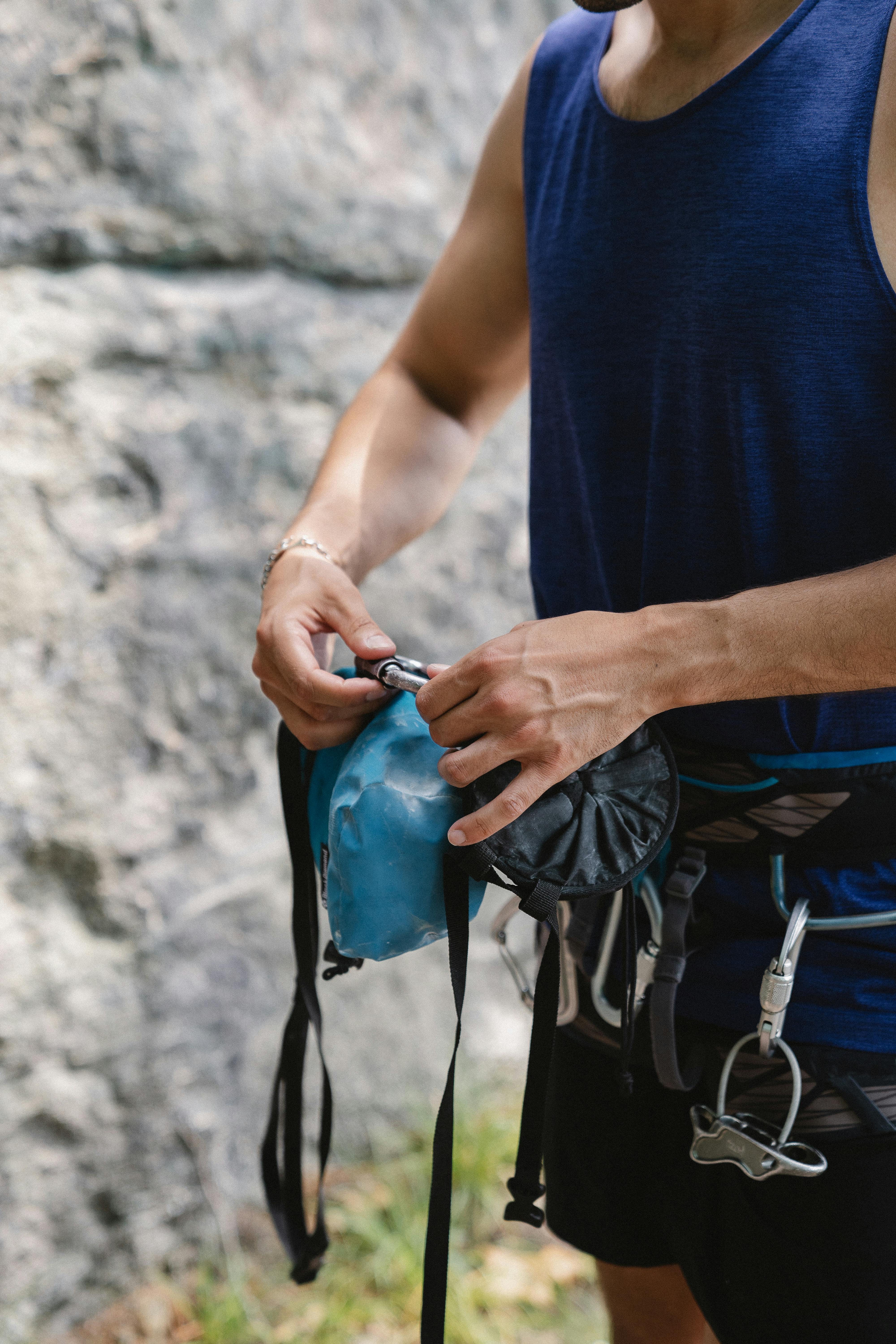 A Person Putting a Harness · Free Stock Photo