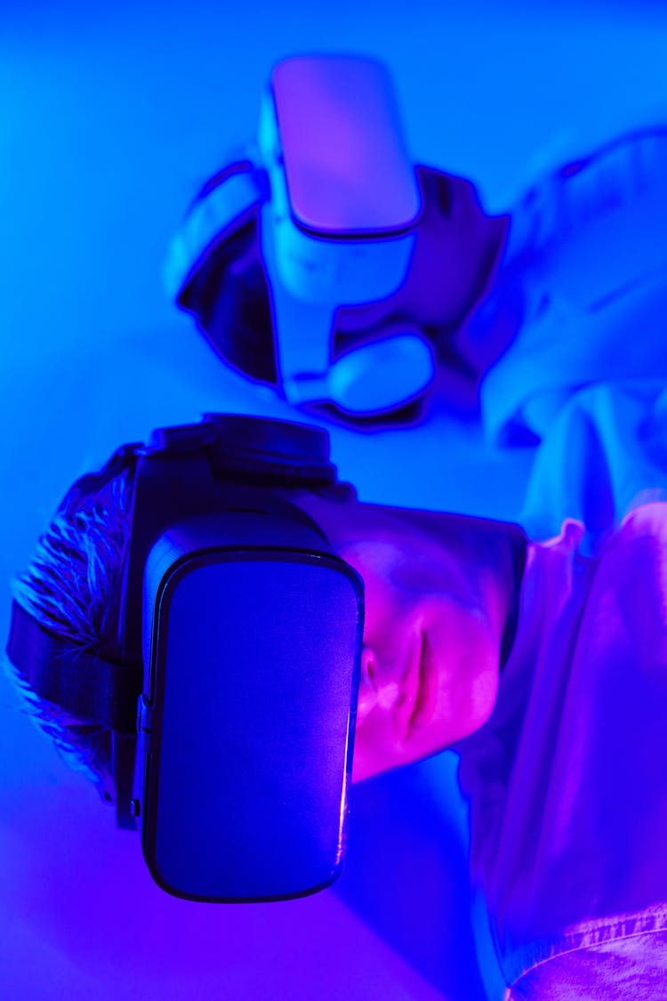 Close-Up Shot Of Two People Using VR Goggles