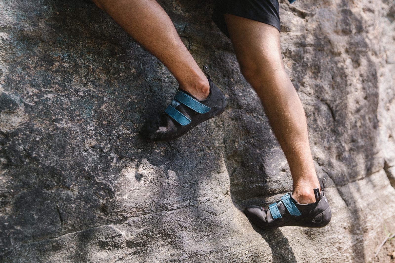 Climber gripping a natural rock face