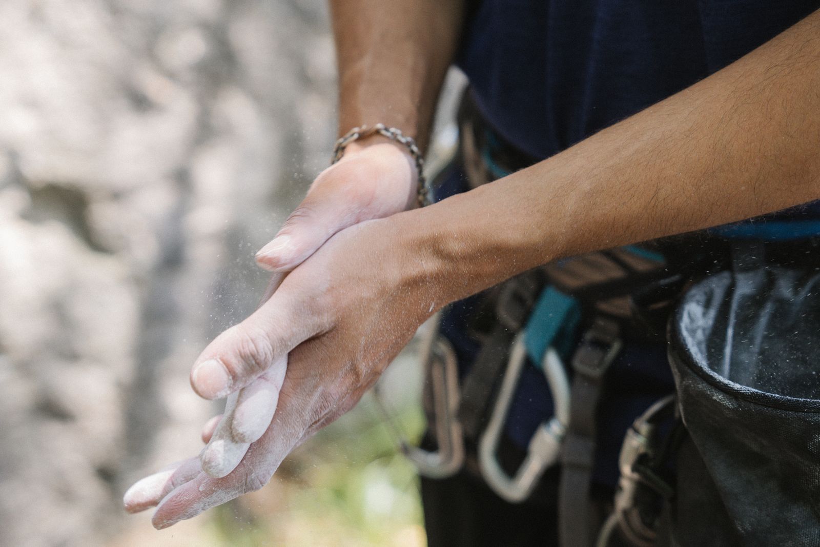 Person wearing wrist support while resting the forearm on a bright table