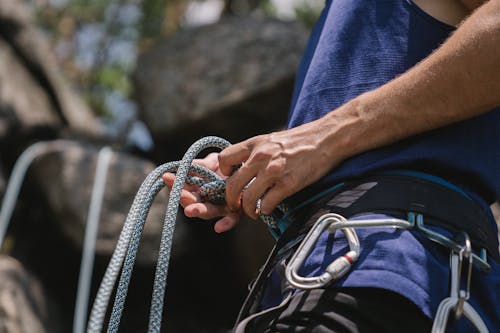 Man Tying Rope Around his Waist