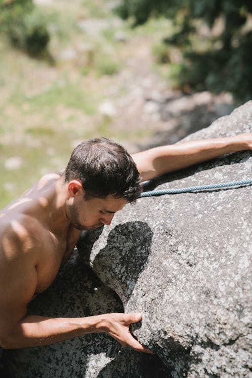 Man Climbing Rocks