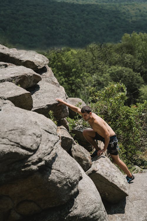Man Climbing Rocks