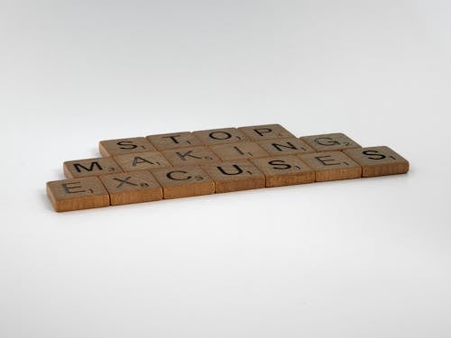 Free Brown Scrabble Tiles on White Surface Stock Photo