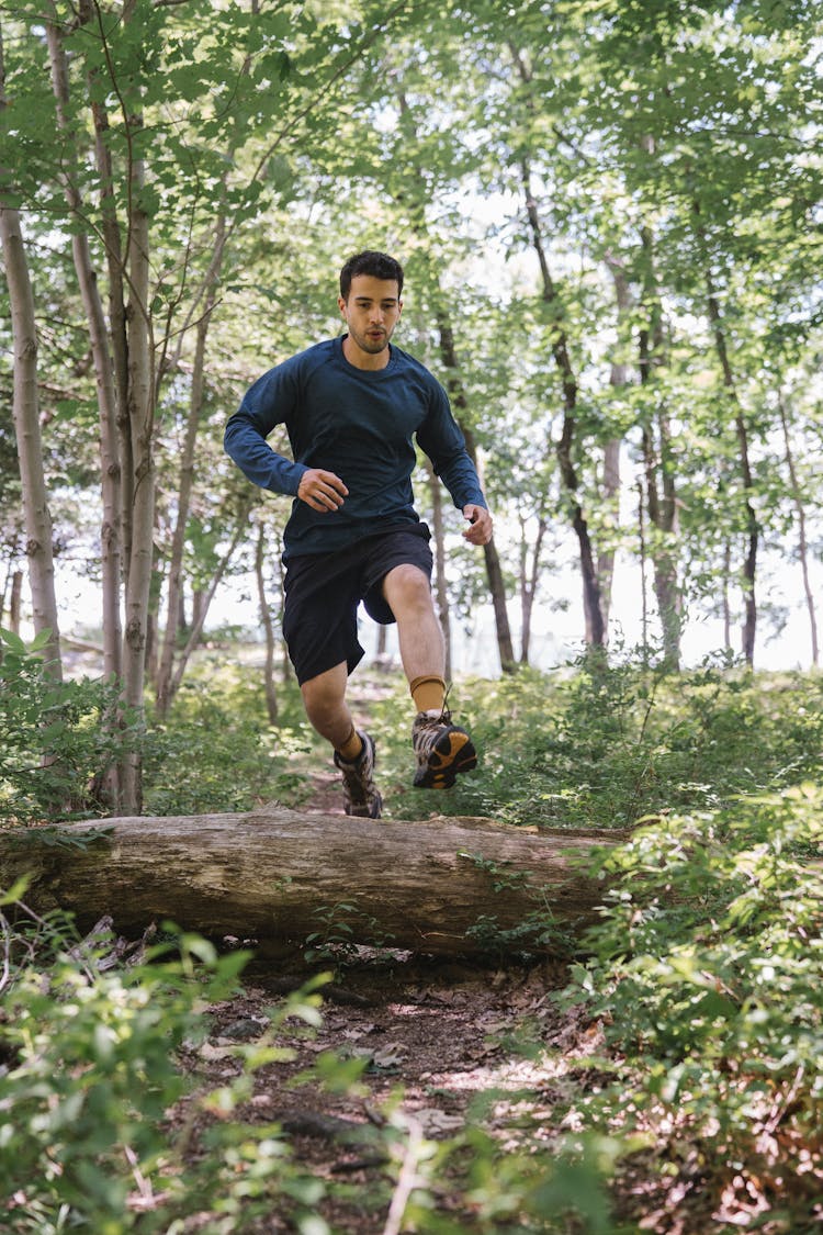 A Man Running In The Forest 