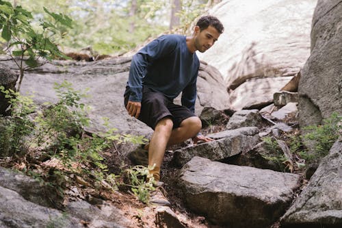 Man Going Down from a Rocky Mountain