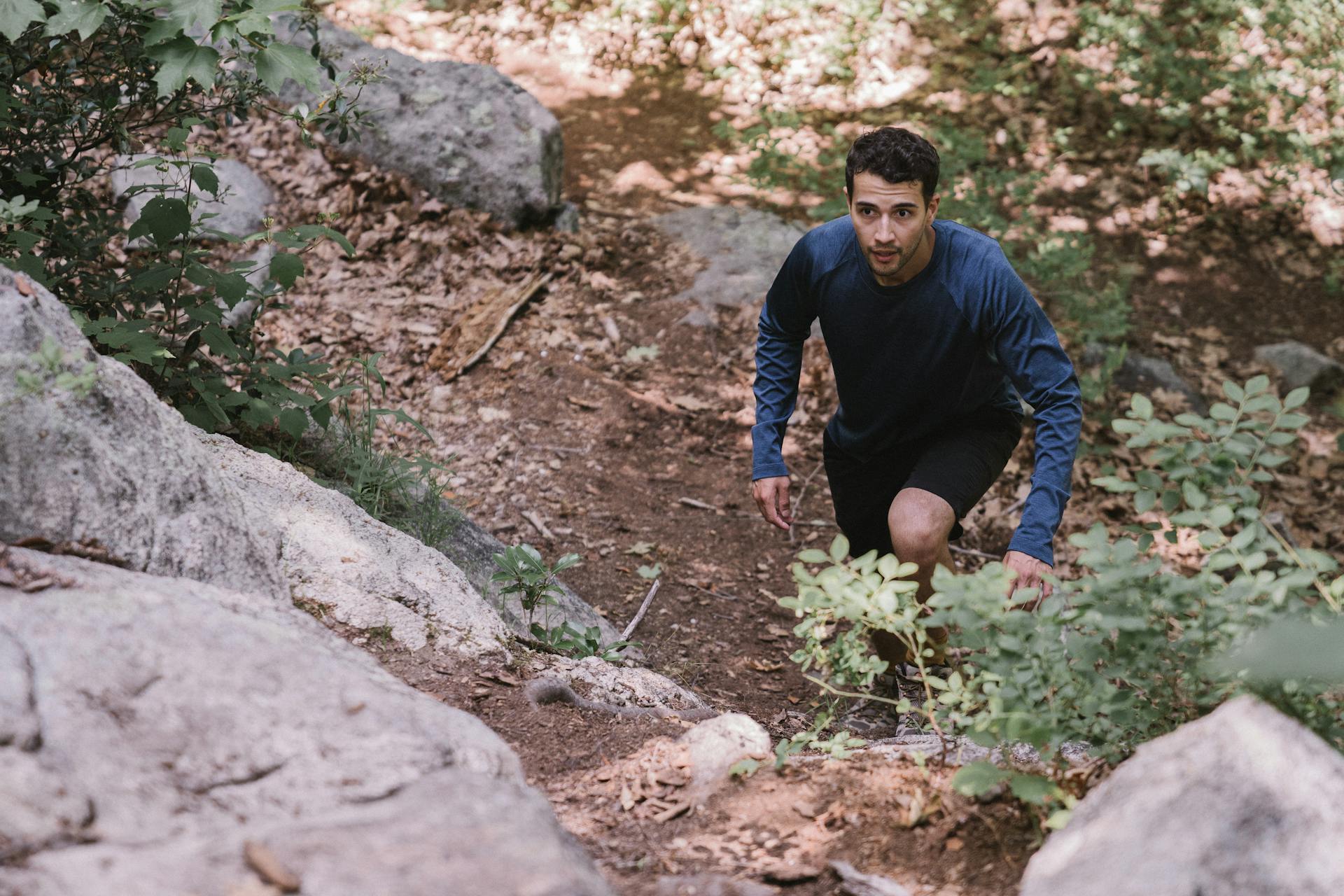 A Man Wearing a Long Sleeved Shirt Hiking