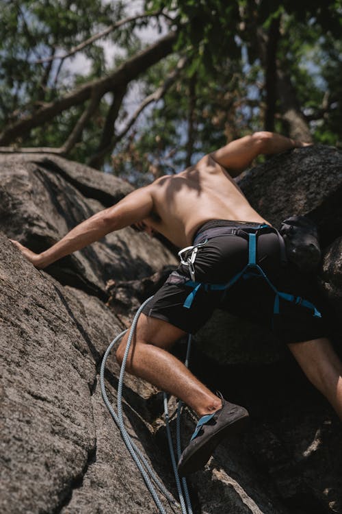 Topless Man Doing Mountain Climbing 