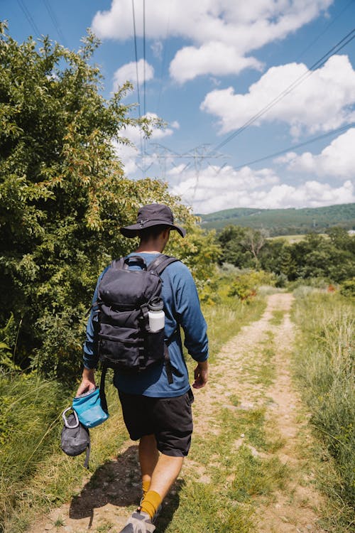 A Man in Blue Long Sleeves Hiking