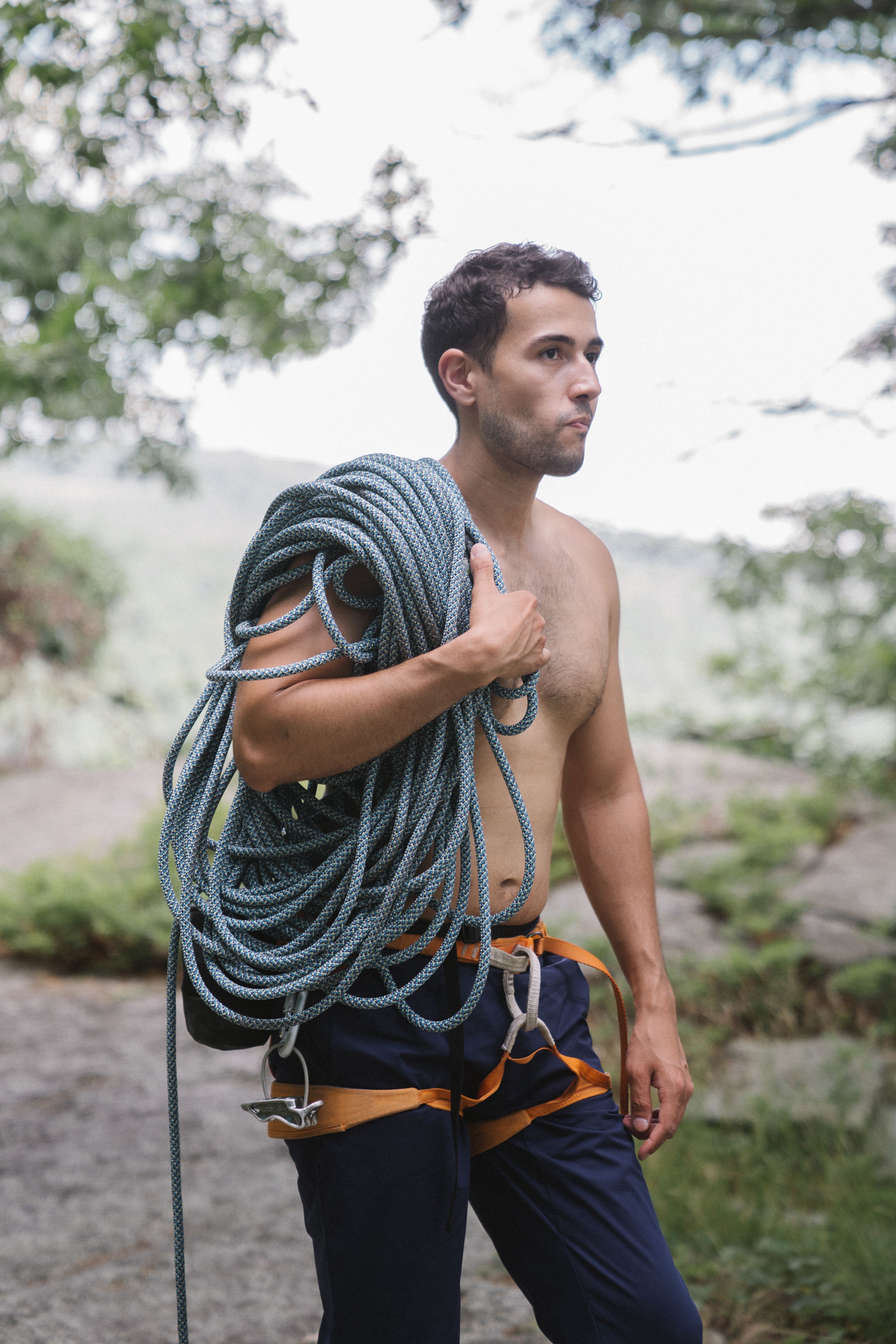 A Shirtless Man Carrying a Rope · Free Stock Photo