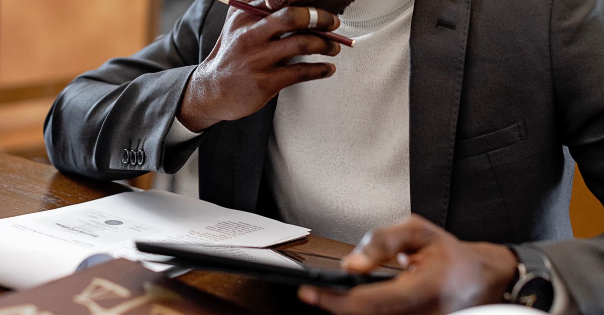 A lawyer reviewing a contract at a desk, representing the legal risk of walking away from a condo deal