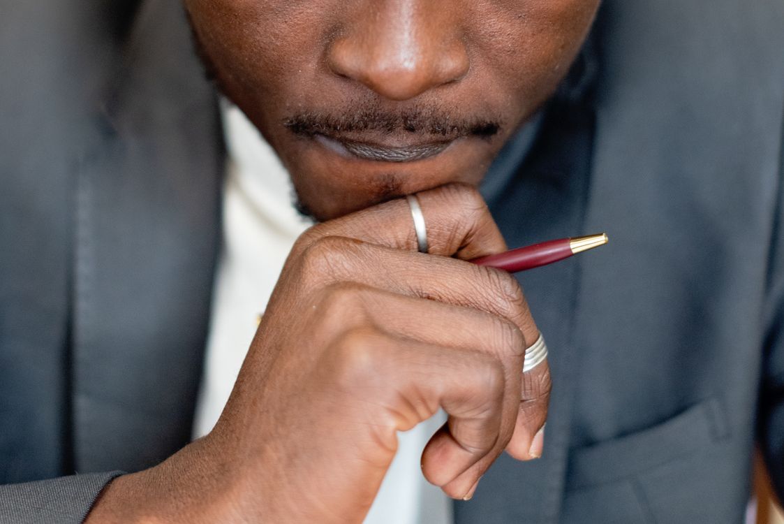A Man Holding a Pen · Free Stock Photo