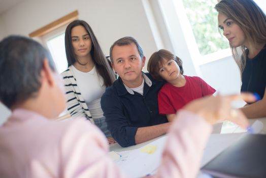 A Family Sitting at the Table