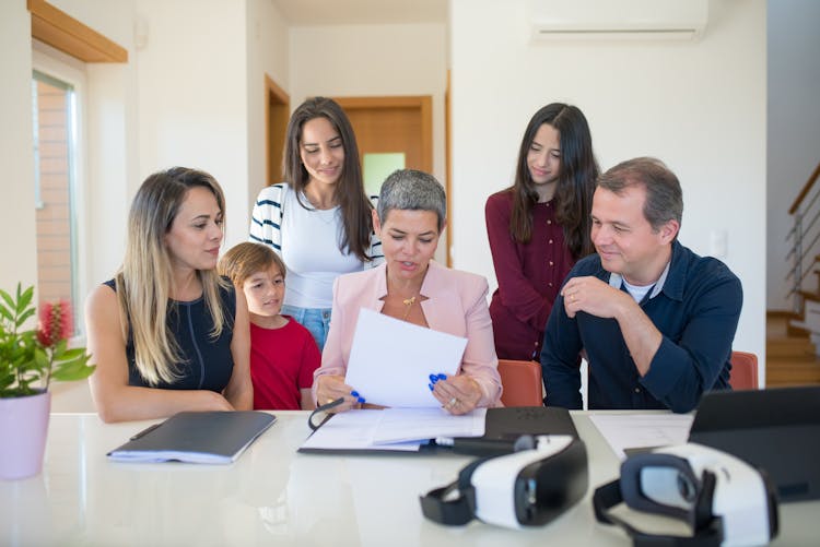 A Family Sitting At The Table