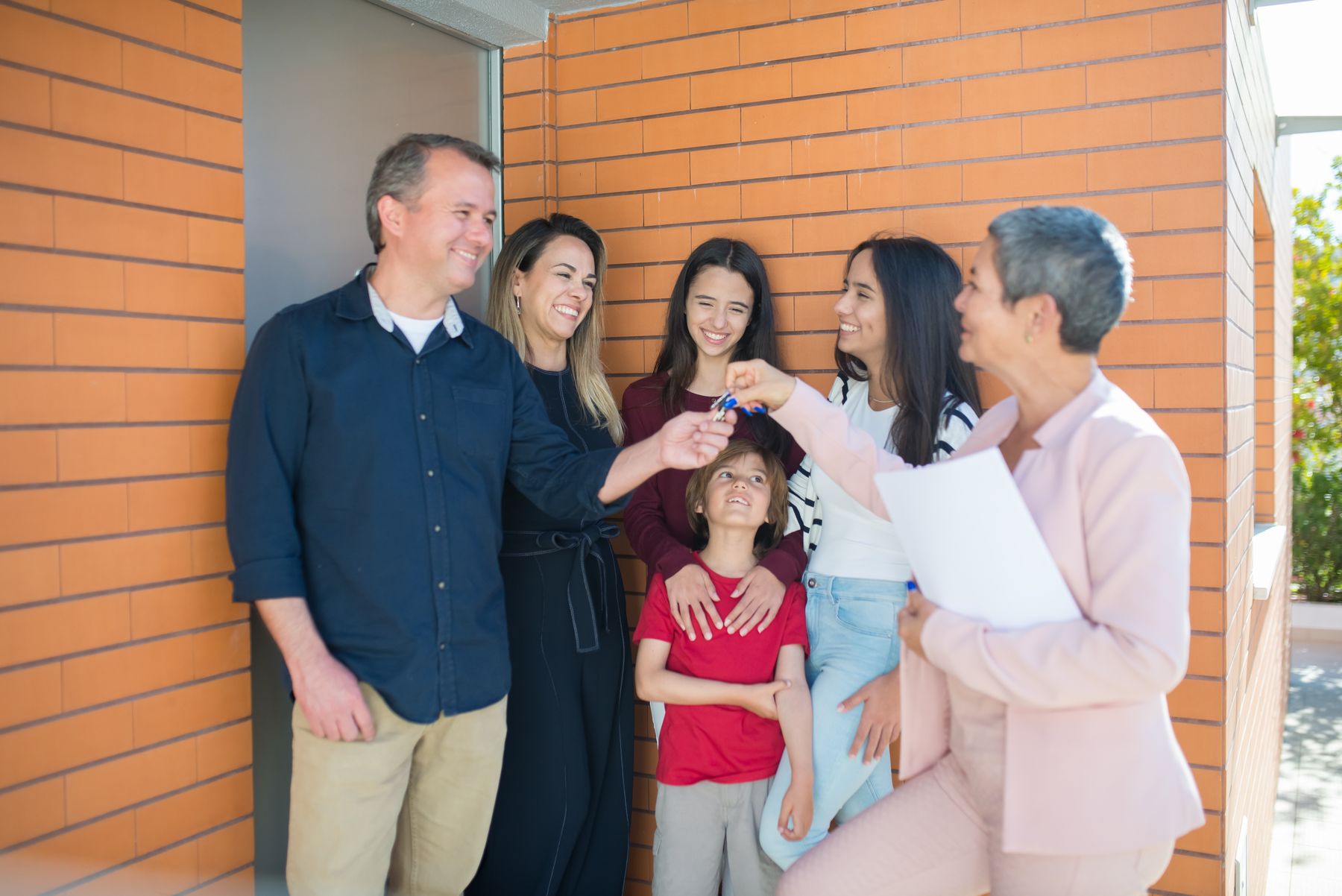 Happy family with new home keys