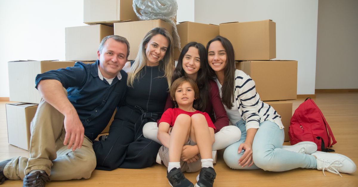 Family moving into a new Canadian home, part of the immigration and housing price debate