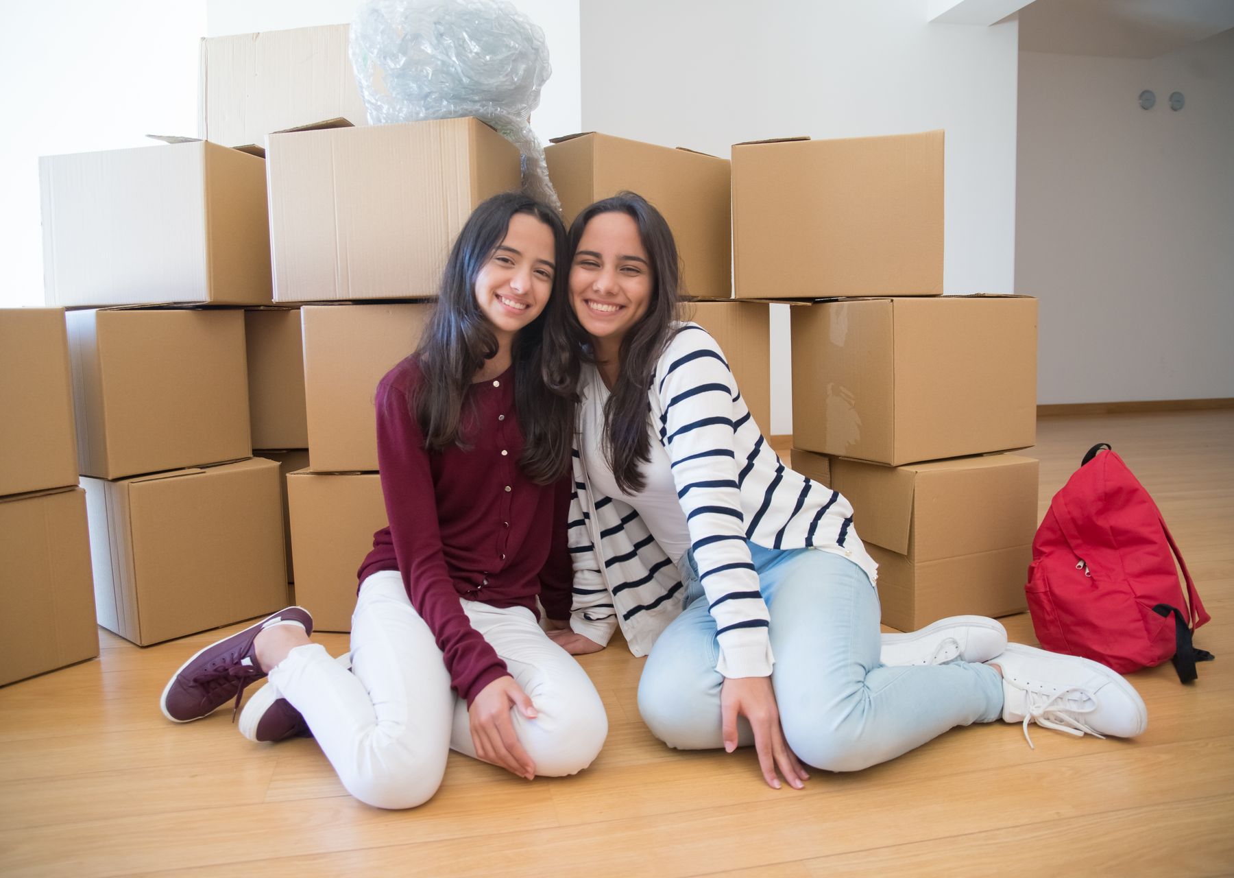 House removals in Acton — crew wrapping and loading on moving day