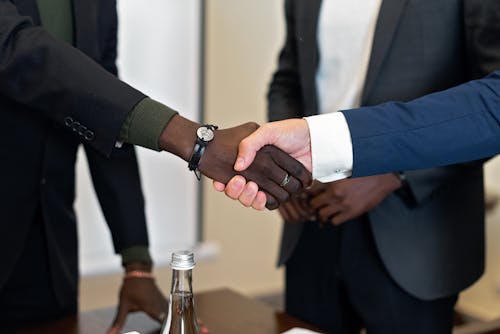Free Close-Up Shot of Two People Shaking Hands Stock Photo