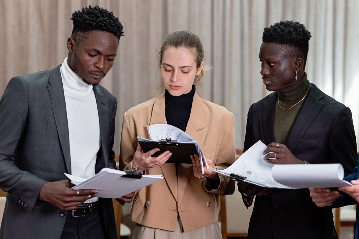 Insurance and business professionals reviewing documents together in an office