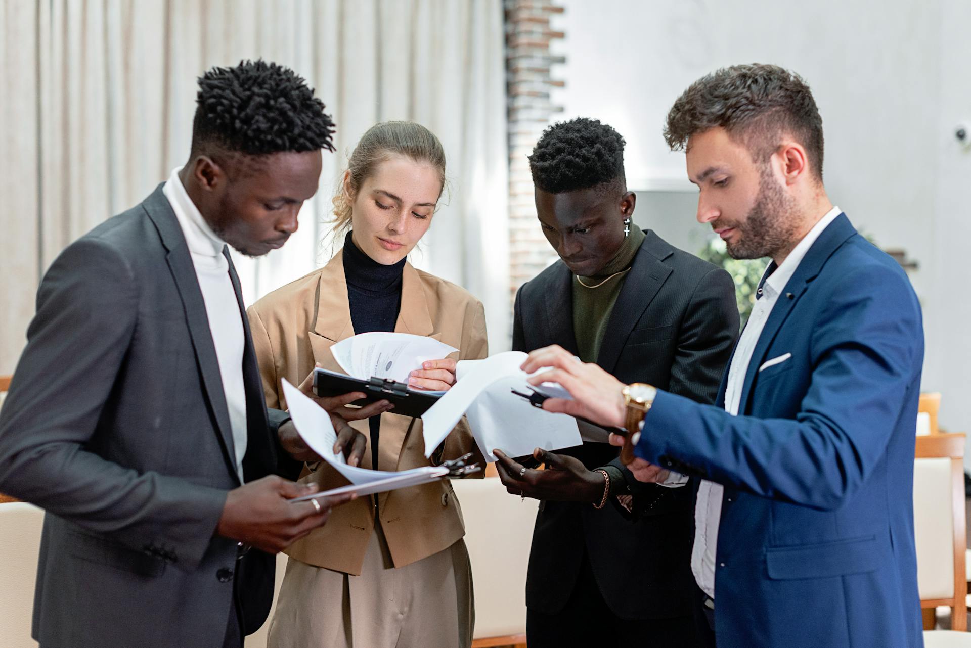 People Standing with Documents 