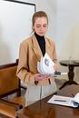 Woman in Brown Blazer Holding White Printer Paper