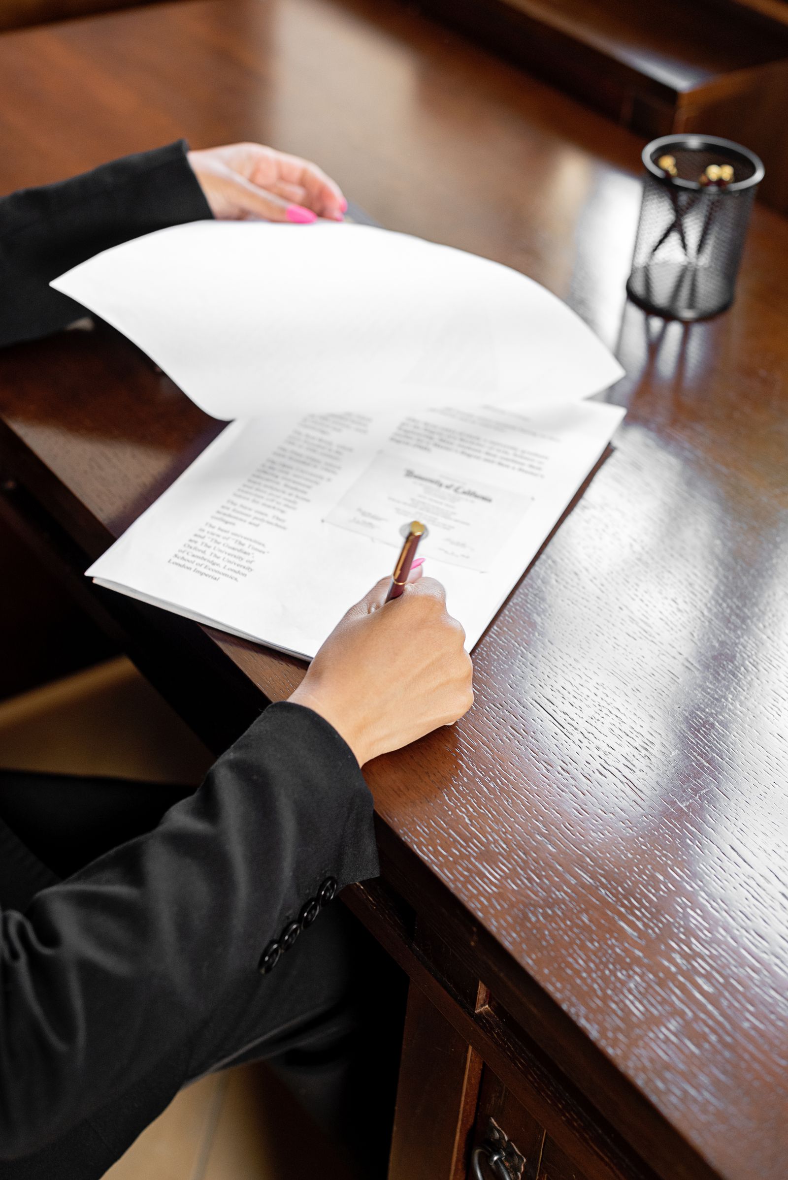 Business professional signing consent and policy paperwork