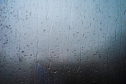 Free Close-Up Shot of Raindrops on a Glass Stock Photo