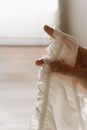 Person Holding White Textile