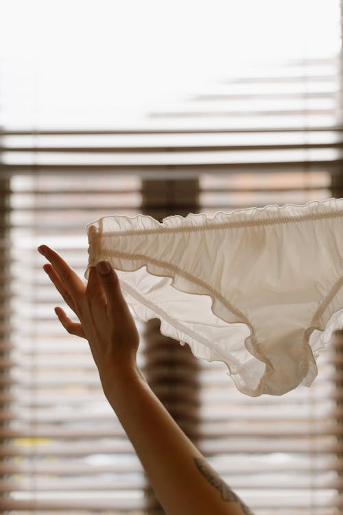 Free Close-Up Shot of a Person Holding a White Undies Stock Photo