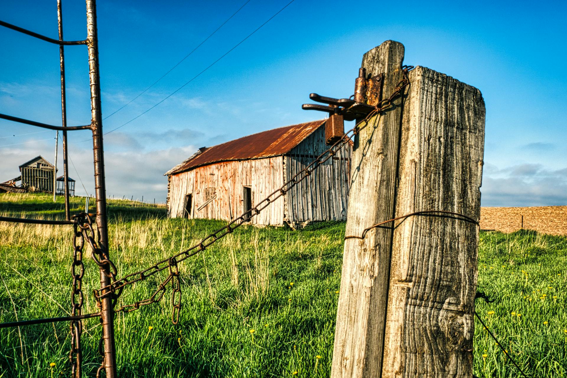 Wooden Pole with Chains near Shed