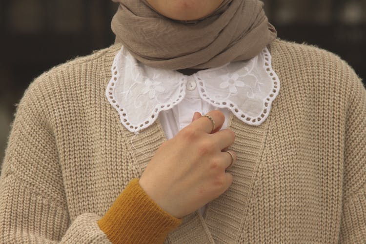 Woman With Her Hand By Her Chest