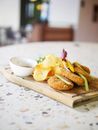 Bread With Cheese and Vegetable on Brown Wooden Chopping Board
